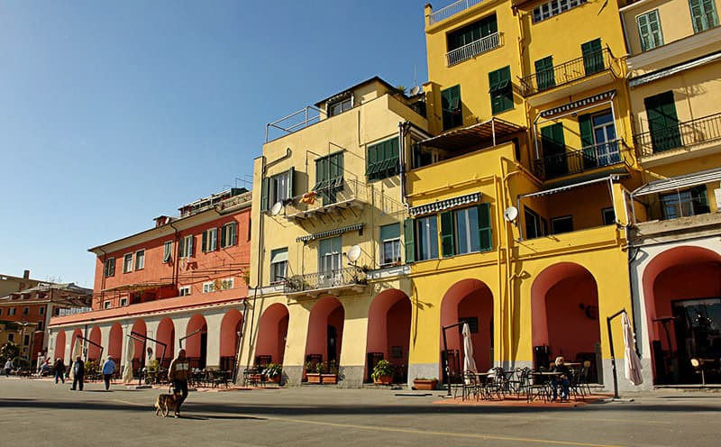 Colorful house facades in Imperia Oneglia by sunset
