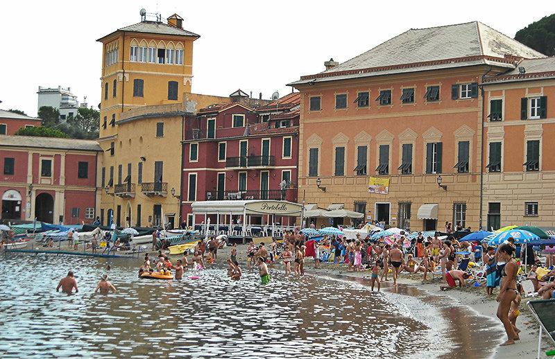 People are enjoying the water at the beach of Sestri Levante