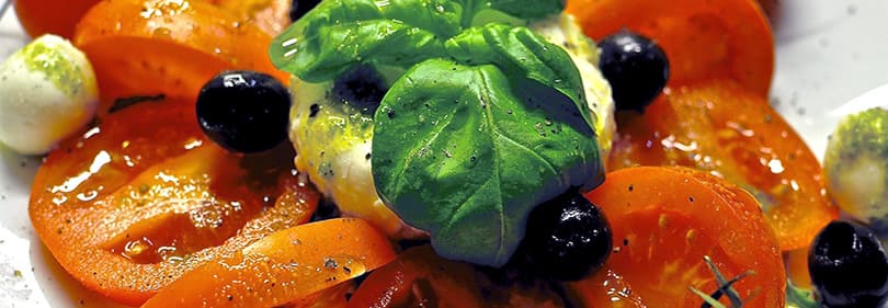 Basil, olives, tomatoes and mozarella - italian specialties