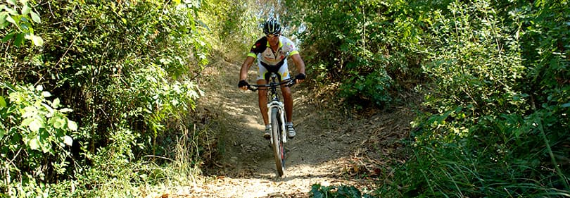 A man is riding a mountain bike in Diano Marina
