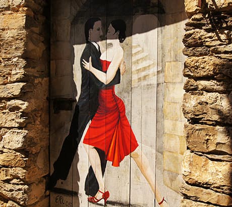 A beautiful painting of a dancing couple on the door in Valloria