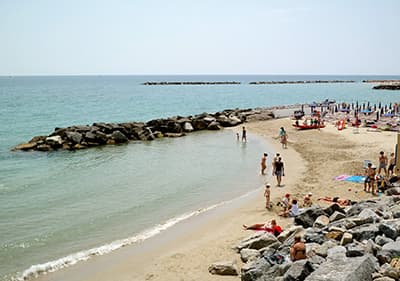 A calm sandy beach in between Pista Ciclabile bike path in between San Lorenzo al Mare and San Remo